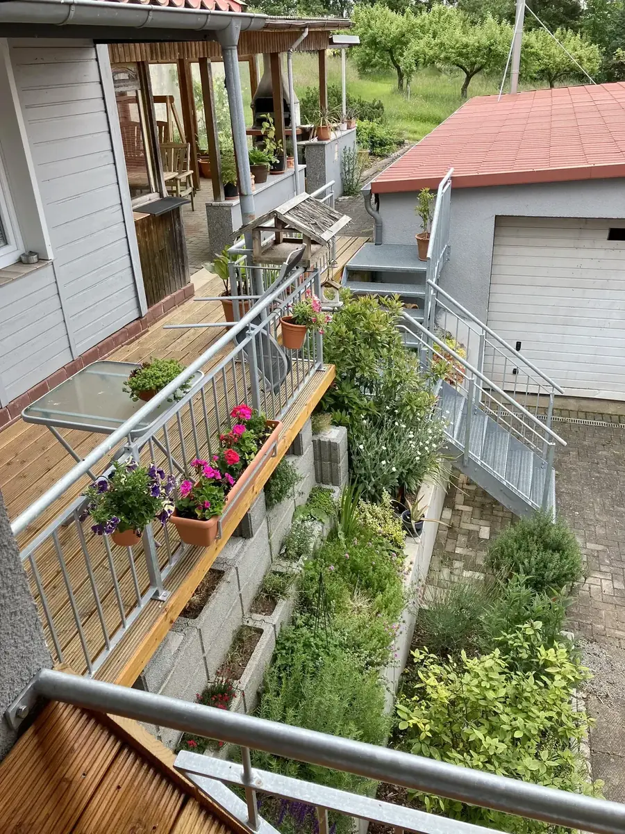 View from the balcony towards terrace and herb garden
