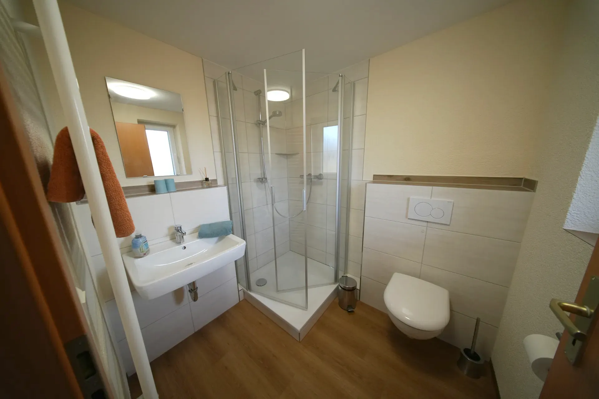 Private bathroom with corner shower and WC