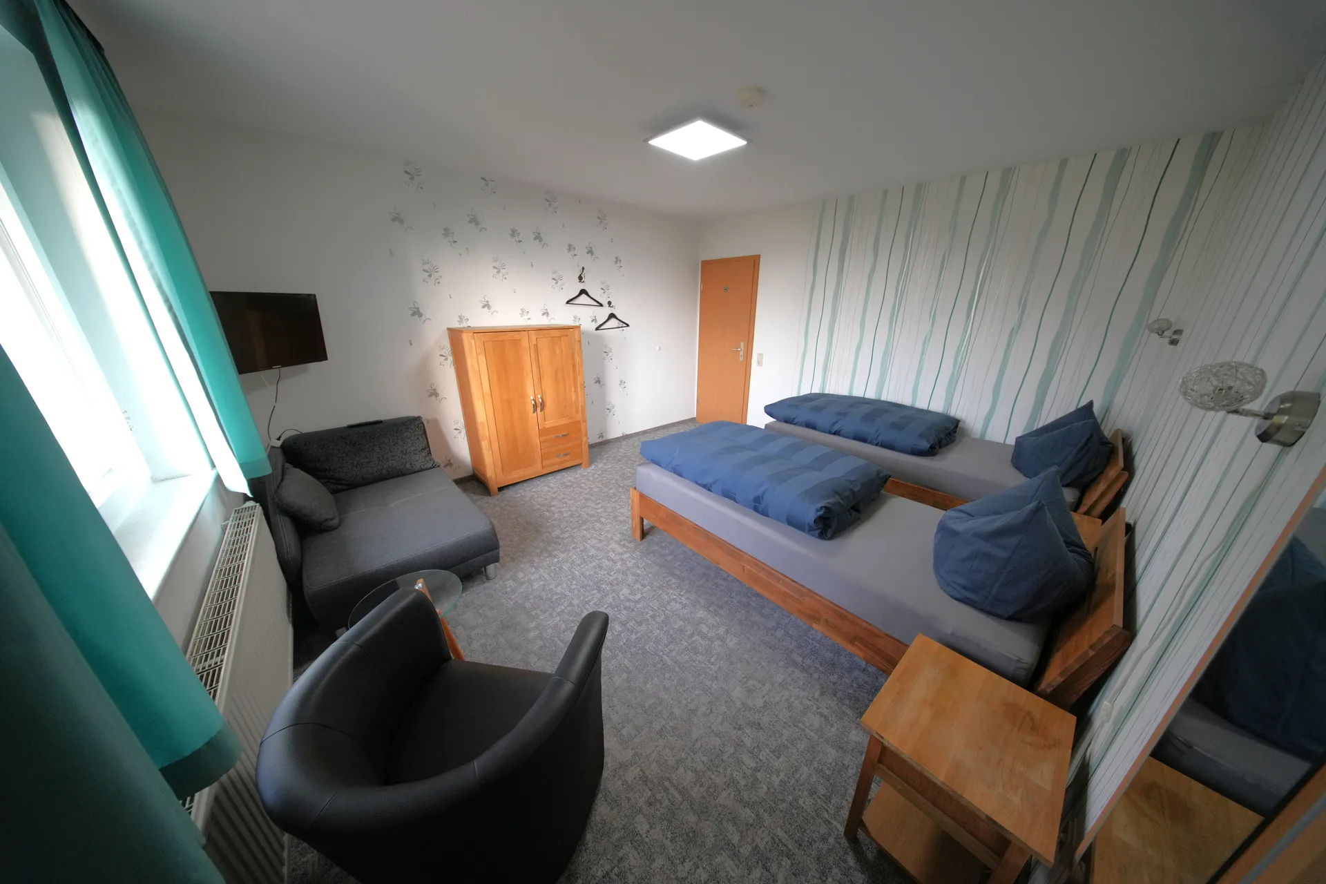 Rose Garden Room – Single beds with armchair and wardrobe