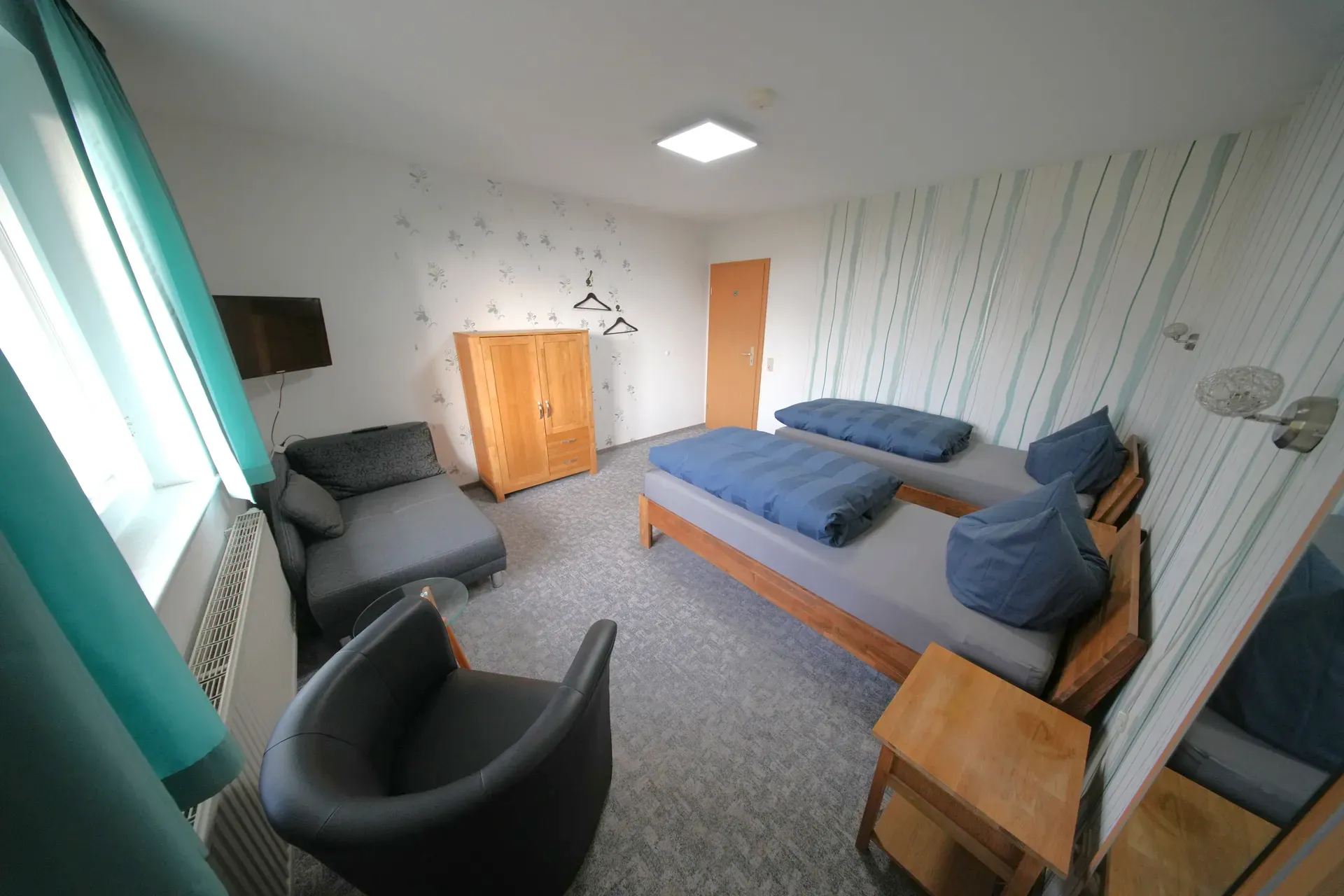 Rose Garden Room – Single beds with armchair and wardrobe