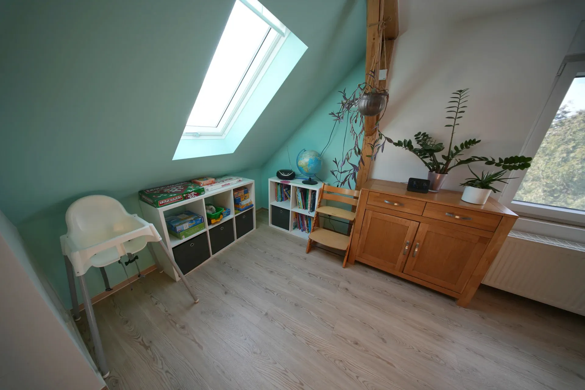 Schöne Aussicht – Children's room with play area, high chair and toy shelves