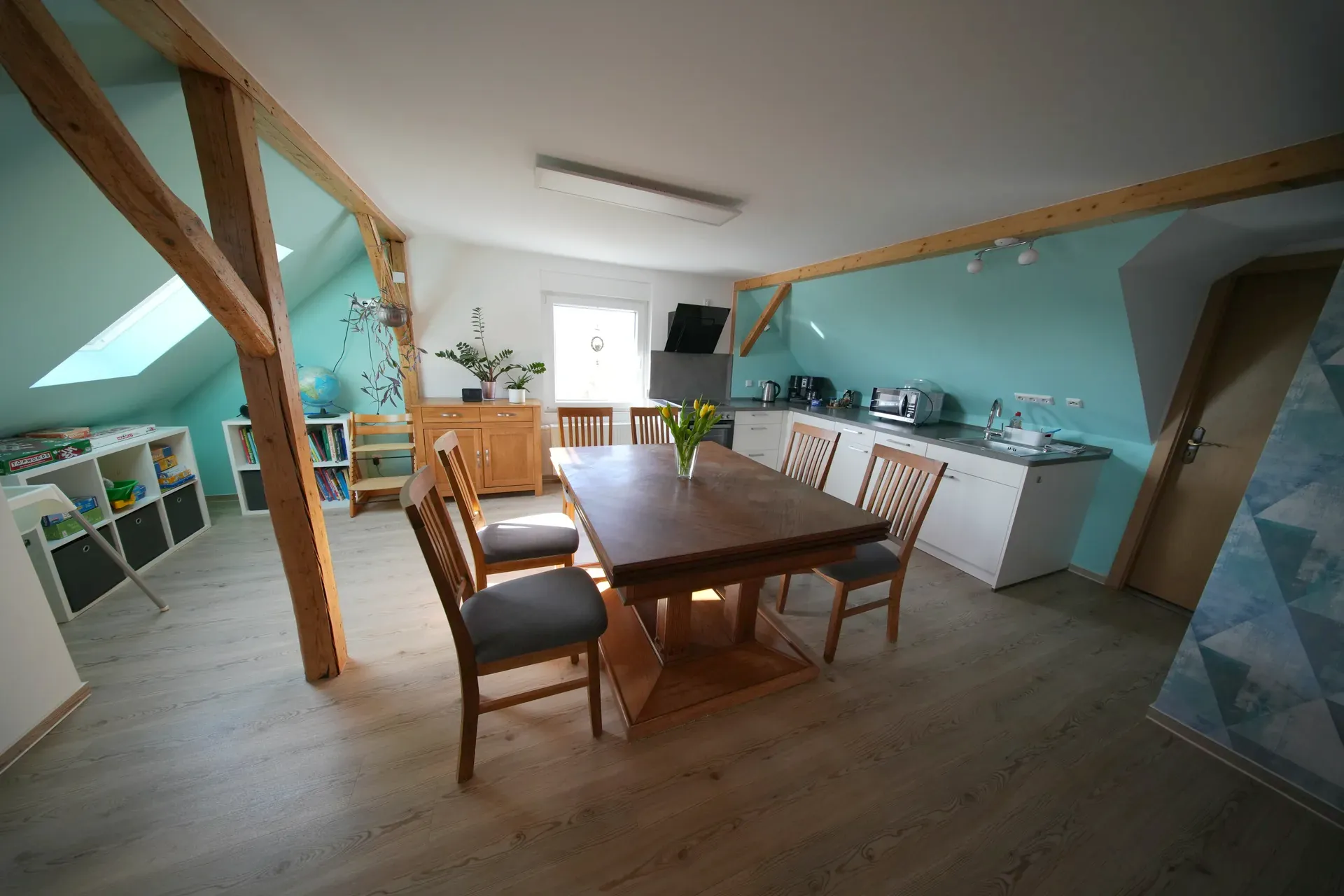 Schöne Aussicht – Open-plan kitchen-living room with dining area and play corner