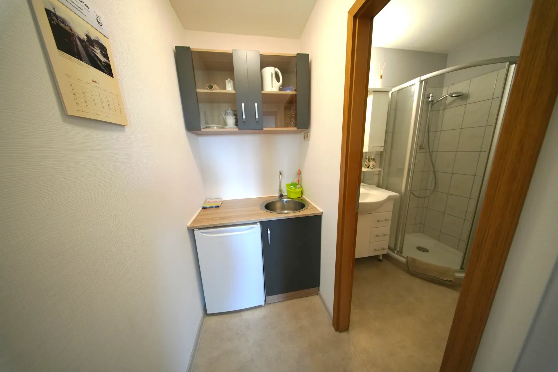 Kitchen area with view towards bathroom